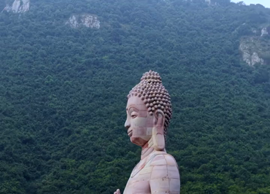 Aerial View of Giant Buddha Statue in Lake Surrounded by Hills Rajgir Bihar India