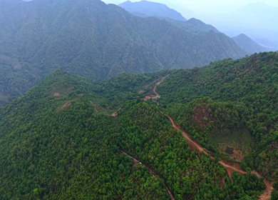 Aerial View of Indian Railways Freight Train Emerging from Tunnel Through Forested Hills, Andhra Pradesh