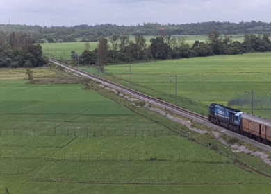 Aerial View of Indian Train Passing Through Green Fields Talaguppa Karnataka
