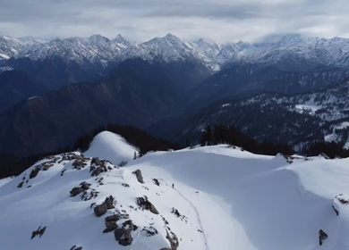 Aerial View of Kedarkantha Winter Trek with Snow Covered Mountains Uttarakhand