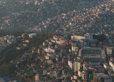 Aerial Drone View of Kohima City Stadium Surrounded by Urban Hills in Nagaland India