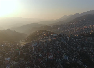 Aerial Drone View of Kohima City Stadium Surrounded by Urban Hills in Nagaland India