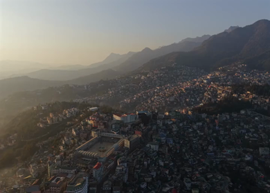 Aerial Drone View of Kohima City Stadium Surrounded by Urban Hills in Nagaland India