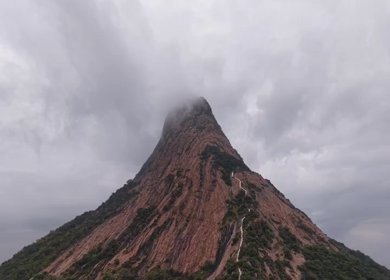 Aerial View of Kondarangi Hills with Rocky Peak and Clouds in Dindigul Tamil Nadu