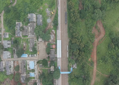 Aerial View of Kottavalasa–Kirandul Railway Line Through Lush Green Hills and Rural Villages, Andhra Pradesh