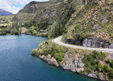 Aerial View of Lake Wanaka and Scenic Mountain Road in Otago New Zealand