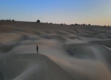 Aerial View of Lone Traveler Walking on Sand Dunes in Jaisalmer Thar Desert India