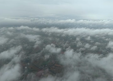 Aerial View of Low Clouds Floating Over Rural Landscape in Tamil Nadu India