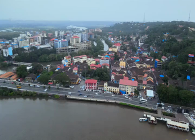 Aerial View of Mandovi River with Ferry and Panaji Cityscape Goa India