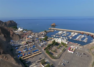 Aerial View of Marina Bandar Al Rowdha Muscat Oman with Yachts and Hajar Mountains