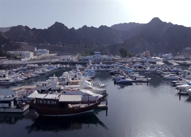 Aerial View of Marina Bandar Al Rowdha Muscat Oman with Yachts and Hajar Mountains