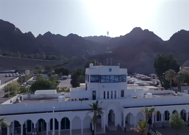 Aerial View of Marina Bandar Al Rowdha Muscat Oman with Yachts and Hajar Mountains