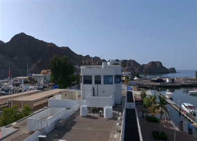 Aerial View of Marina Bandar Al Rowdha Muscat Oman with Yachts and Hajar Mountains