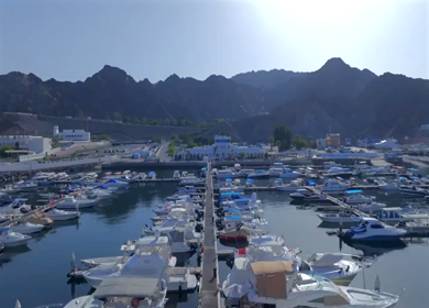 Aerial View of Marina Bandar Al Rowdha Muscat Oman with Yachts and Hajar Mountains