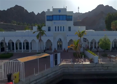 Aerial View of Marina Bandar Al Rowdha Muscat Oman with Yachts and Hajar Mountains