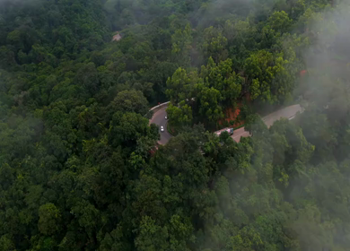 Aerial View of Misty Forest and Winding Road in Kanyakumari Tamil Nadu