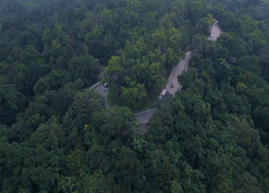 Aerial View of Misty Forest and Winding Road in Kanyakumari Tamil Nadu