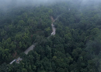 Aerial View of Misty Forest and Winding Road in Kanyakumari Tamil Nadu