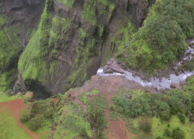 Aerial View of Monsoon Waterfall and Misty Mountains in Maharashtra India
