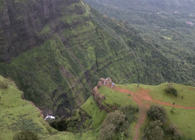 Aerial View of Monsoon Waterfall and Misty Mountains in Maharashtra India