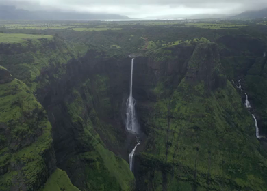 Aerial View of Monsoon Waterfall and Misty Mountains in Maharashtra India