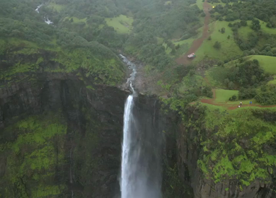 Aerial View of Monsoon Waterfall and Misty Mountains in Maharashtra India