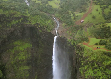 Aerial View of Monsoon Waterfall and Misty Mountains in Maharashtra India