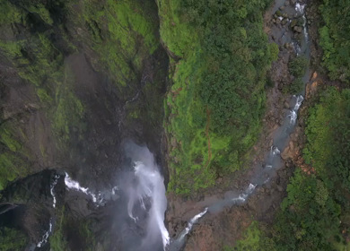 Aerial View of Monsoon Waterfall and Misty Mountains in Maharashtra India