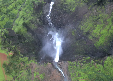 Aerial View of Monsoon Waterfall and Misty Mountains in Maharashtra India