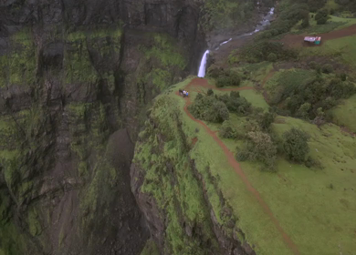 Aerial View of Monsoon Waterfall and Misty Mountains in Maharashtra India