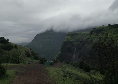 Aerial View of Monsoon Waterfall and Misty Mountains in Maharashtra India