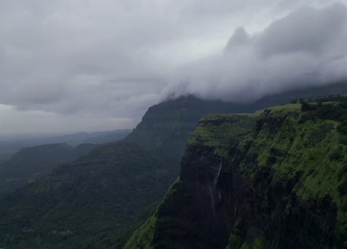 Aerial View of Monsoon Waterfall and Misty Mountains in Maharashtra India