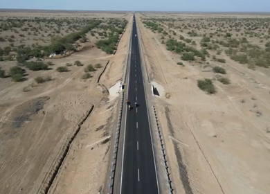 Aerial View of Motorcycles Riding on Desert Highway in Kutch Gujarat India