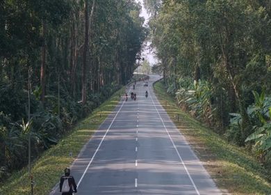 Aerial Drone View of Motorcyclists Riding Through Forest Road in Nagaland, India
