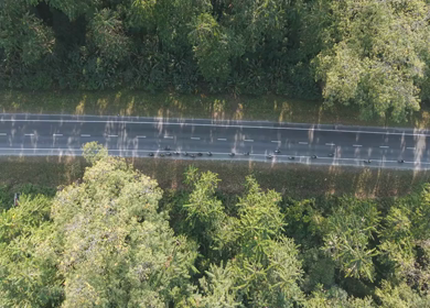 Aerial Drone View of Motorcyclists Riding Through Forest Road in Nagaland, India