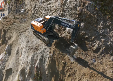 05th April 2026 : Aerial View of Mountain Road Construction and Landslide Clearing in India