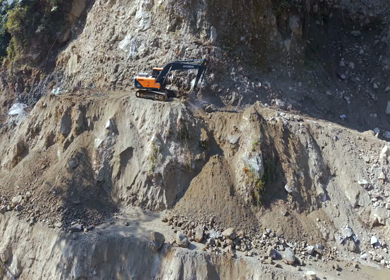 05th April 2026 : Aerial View of Mountain Road Construction and Landslide Clearing in India