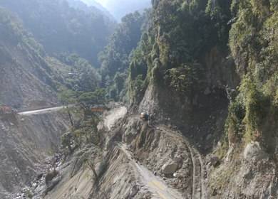 Aerial View of Mountain Road Construction and Landslide Clearing in India