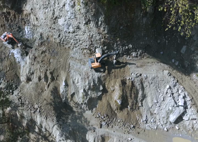 Aerial View of Mountain Road Construction and Landslide Clearing in India