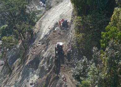 Aerial View of Mountain Road Construction and Landslide Clearing in India