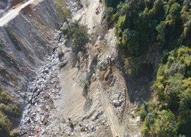 Aerial View of Mountain Road Construction and Landslide Clearing in India
