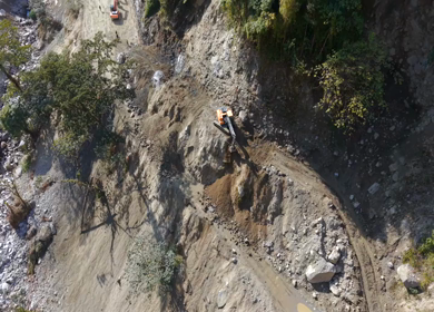Aerial View of Mountain Road Construction and Landslide Clearing in India