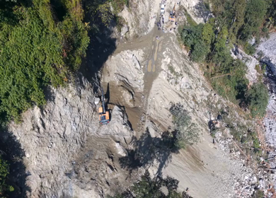 Aerial View of Mountain Road Construction and Landslide Clearing in India