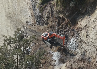 05th April 2026 : Aerial View of Mountain Road Construction and Landslide Clearing in India