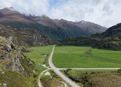 Aerial View of Mountain Road and Alpine Valley Near Lake Wanaka New Zealand