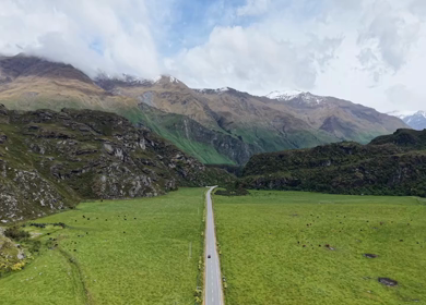 Aerial View of Mountain Road and Alpine Valley Near Lake Wanaka New Zealand