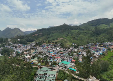 Aerial View of Munnar Town Surrounded by Tea Plantations and Western Ghats, Kerala, India