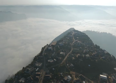 Aerial View of Nongjrong Village Above Sea of Clouds in Meghalaya