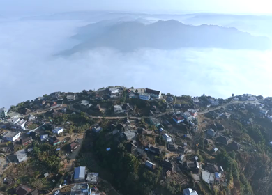 Aerial View of Nongjrong Village Above Sea of Clouds in Meghalaya