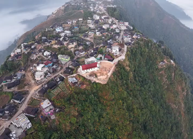 Aerial View of Nongjrong Village Above Sea of Clouds in Meghalaya
